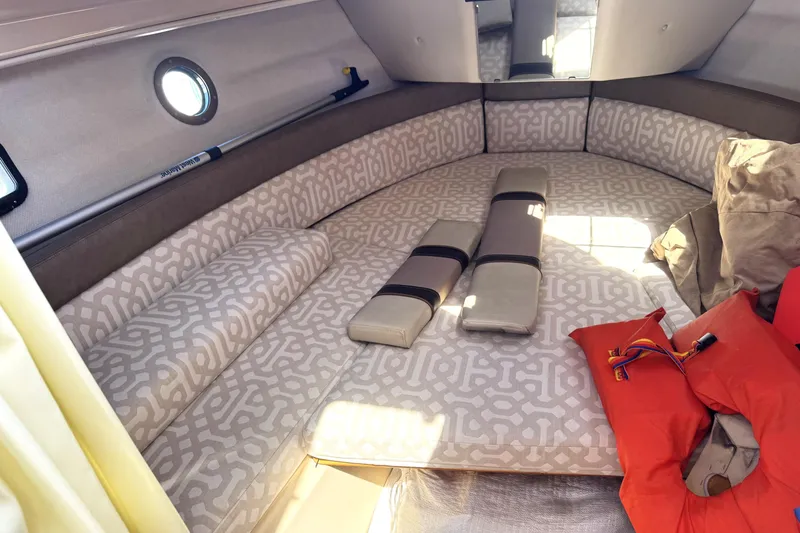 Slide: The Image of 2019 Ranger Tugs R-23 cabin interior with patterned cushions and life jackets. - 5