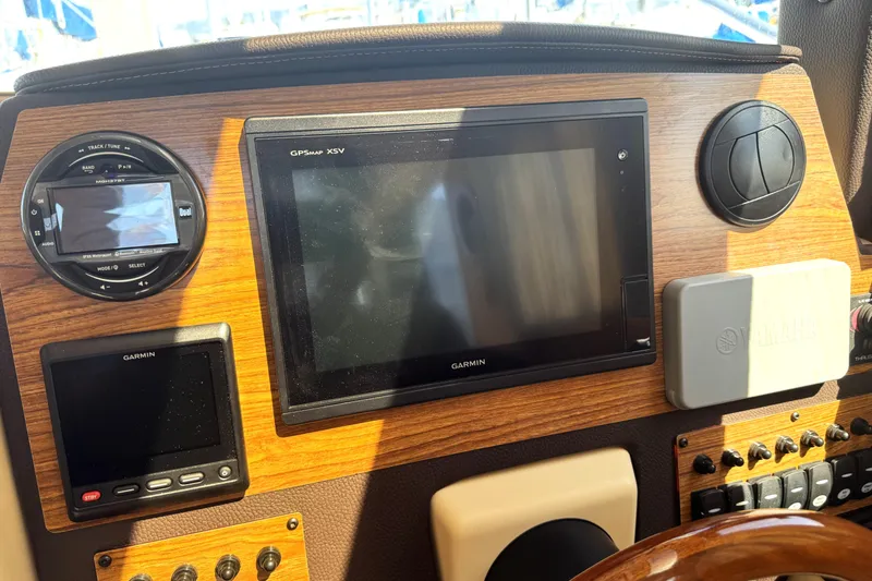 Slide: The Image of 2019 Ranger Tugs R-23 dashboard with Garmin GPS and Yamaha controls. - 9