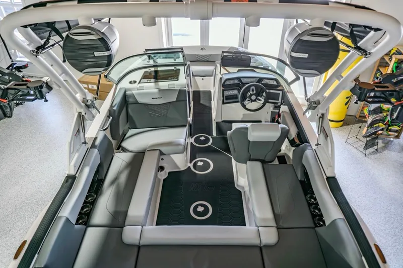Slide: The Image of 2026 MasterCraft NXT20 boat interior with modern seating and advanced dashboard features. - 2