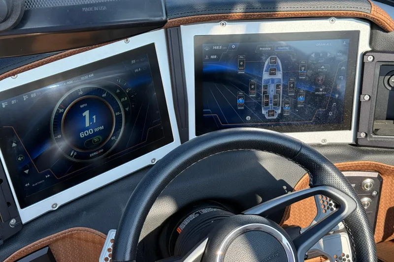 Slide: The Image of 2023 Centurion Ri230 dashboard with dual digital displays and steering wheel. - 16