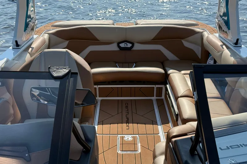 Slide: The Image of 2023 Centurion Ri230 boat interior with luxurious seating and sleek design. - 20