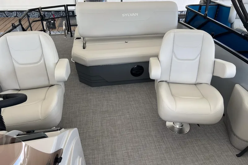 Slide: The Image of 2026 Sylvan MIRAGE 822 CLZ DH boat interior with plush seating and modern design. - 12