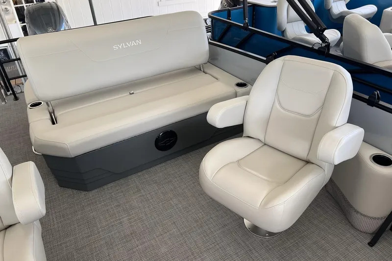 Slide: The Image of 2026 Sylvan MIRAGE 822 CLZ DH boat interior with plush seating and modern design. - 13