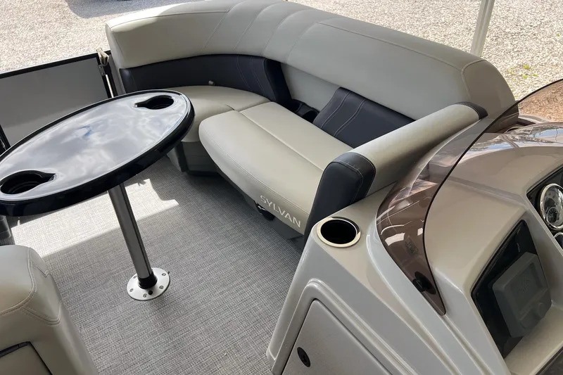 Slide: The Image of Interior of 2026 Sylvan MIRAGE 822 CLZ DH pontoon boat with seating and table. - 14