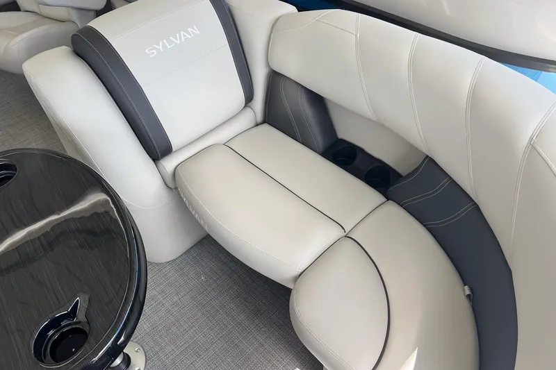 Slide: The Image of Luxurious seating in 2026 Sylvan MIRAGE 822 CLZ DH boat with cup holders and table. - 16
