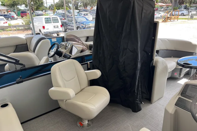 Slide: The Image of Interior of 2026 Sylvan MIRAGE 822 CLZ DH pontoon boat with seating and steering console. - 18