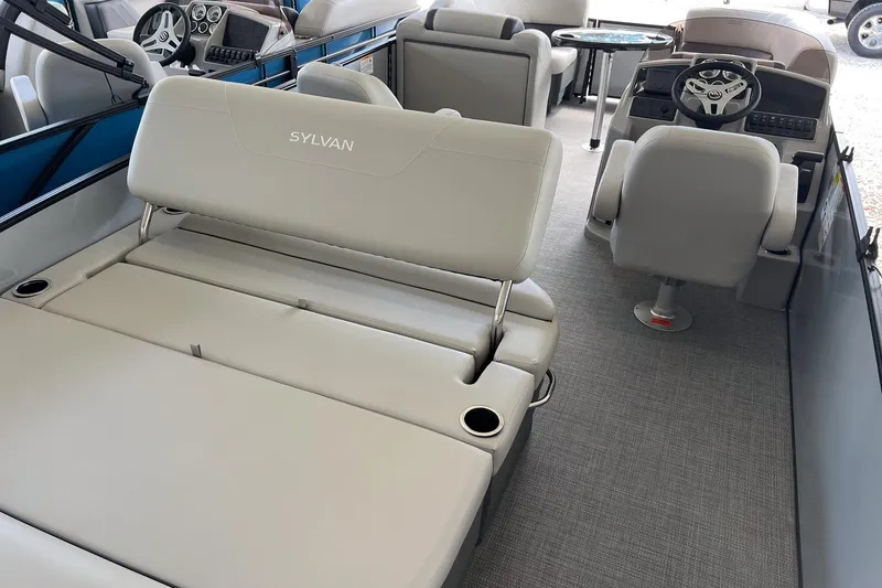 Slide: The Image of 2026 Sylvan MIRAGE 822 CLZ DH interior with plush seating and modern dashboard. - 7