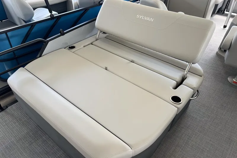 Slide: The Image of 2026 Sylvan MIRAGE 822 CLZ DH boat interior with beige seating and cup holders. - 8