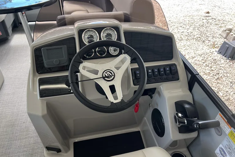 Slide: The Image of Steering console of 2026 Sylvan MIRAGE 822 CLZ DH boat with modern controls and gauges. - 9
