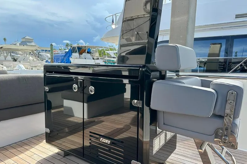 Slide: The Image of Luxury yacht deck of 2016 Fjord 48 Open with sleek black cabinetry. - 11