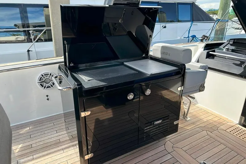 Slide: The Image of Outdoor kitchen on 2016 Fjord 48 Open yacht with sleek black cabinetry. - 12