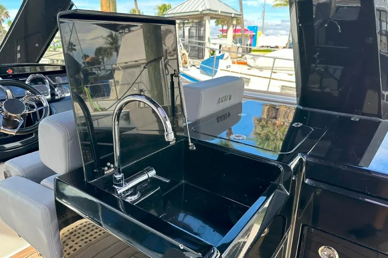 Slide: The Image of Luxury yacht kitchen area on a 2016 Fjord 48 Open, featuring a sleek black sink. - 13