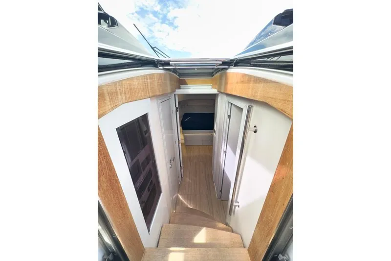 Slide: The Image of Interior view of 2016 Fjord 48 Open yacht, featuring wooden finishes and modern design. - 20