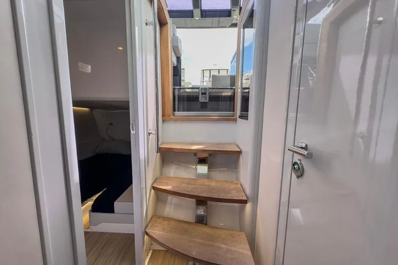 Slide: The Image of Interior view of 2016 Fjord 48 Open yacht with wooden steps and cabin access. - 21