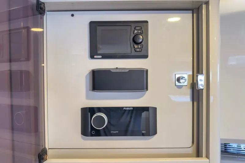 Slide: The Image of Control panel on a 2016 Fjord 48 Open yacht, featuring navigation and audio systems. - 28