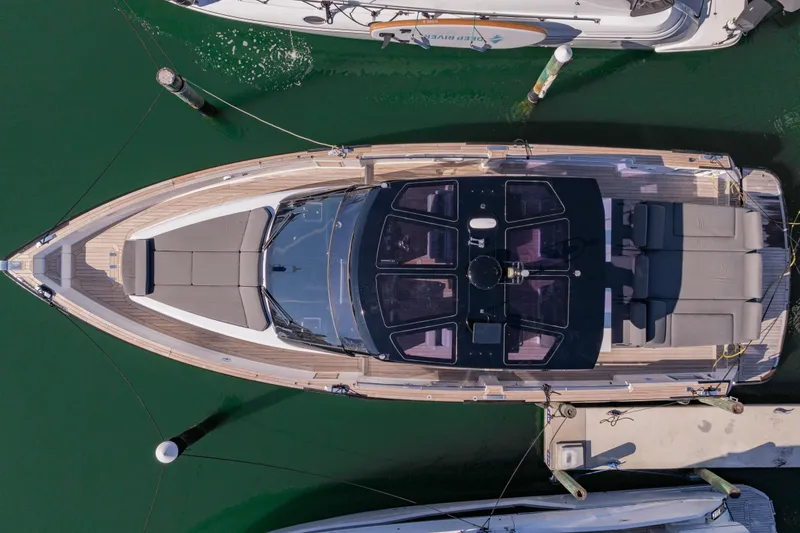 Slide: The Image of Overhead view of a 2016 Fjord 48 Open yacht docked in a marina. - 3