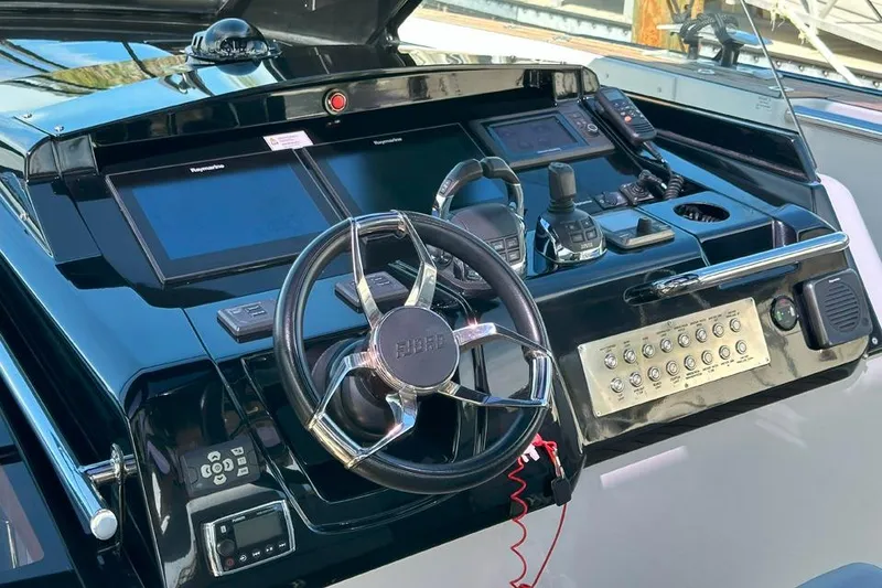 Slide: The Image of Control panel of a 2016 Fjord 48 Open yacht with steering wheel and navigation instruments. - 37