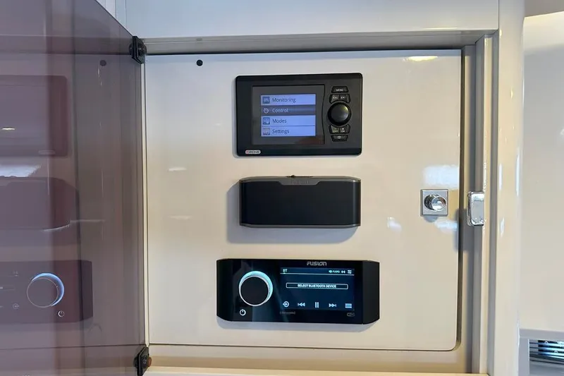 Slide: The Image of Control panel of a 2016 Fjord 48 Open yacht with monitoring and media settings. - 44