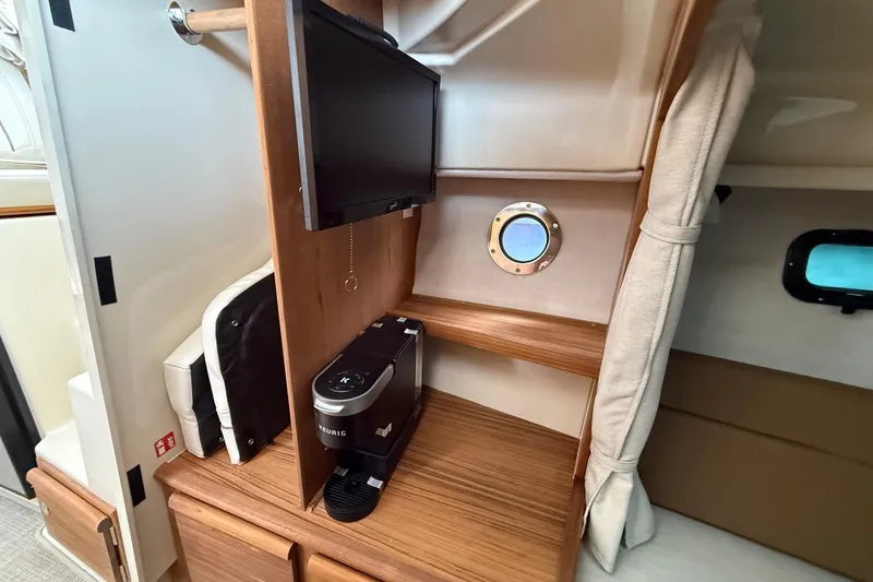 Slide: The Image of 2026 Ranger Tugs R-27 boat interior, featuring spacious seating and modern design. - 16