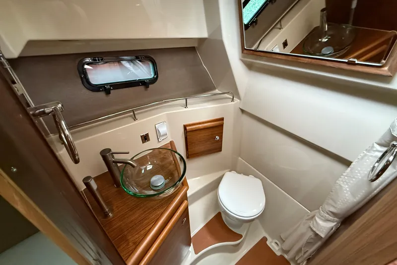 Slide: The Image of 2026 Ranger Tugs R-27 interior seating area with modern design and comfortable upholstery. - 18