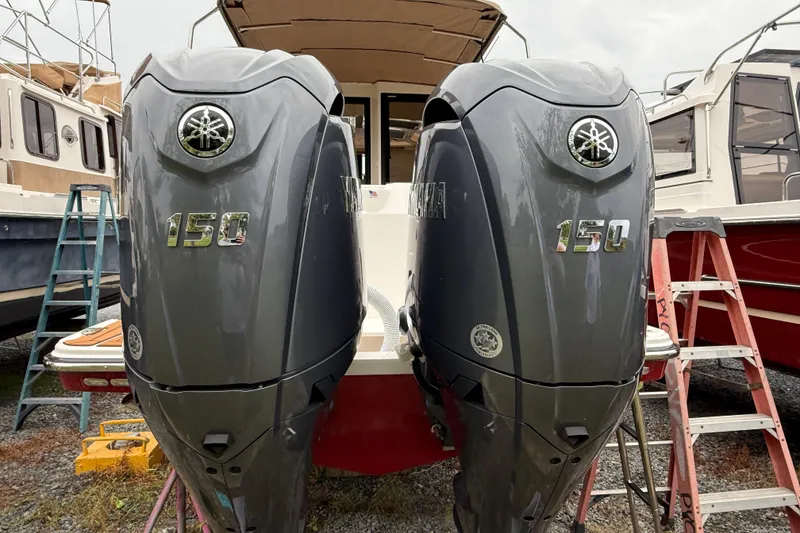 Slide: The Image of 2026 Ranger Tugs R-27 cruising on a scenic lake with mountain backdrop. - 3