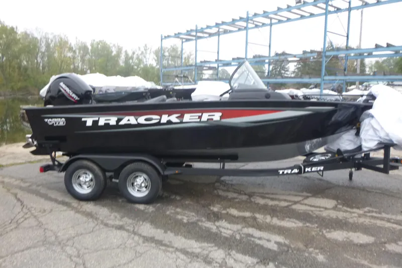 The Image of 2026 Tracker Targa V-18 Combo boat on trailer, parked outdoors. - 1