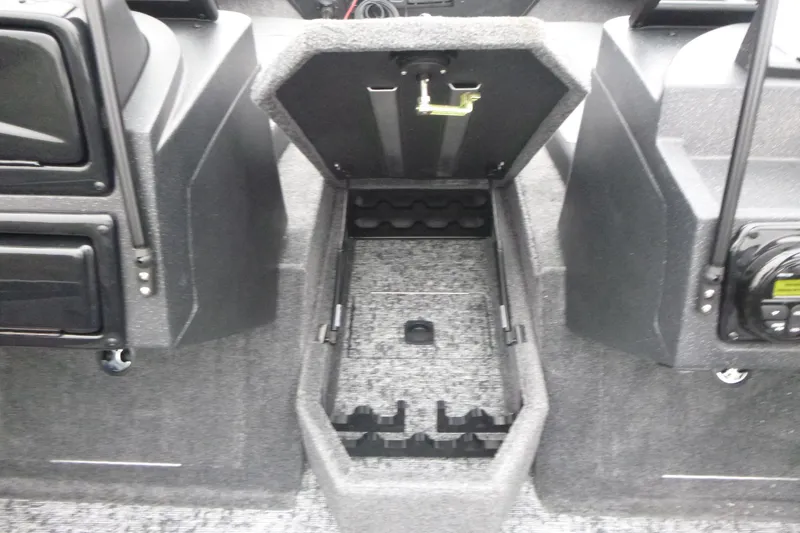 Slide: The Image of 2026 Tracker Targa V-18 Combo boat interior storage compartment open. - 10