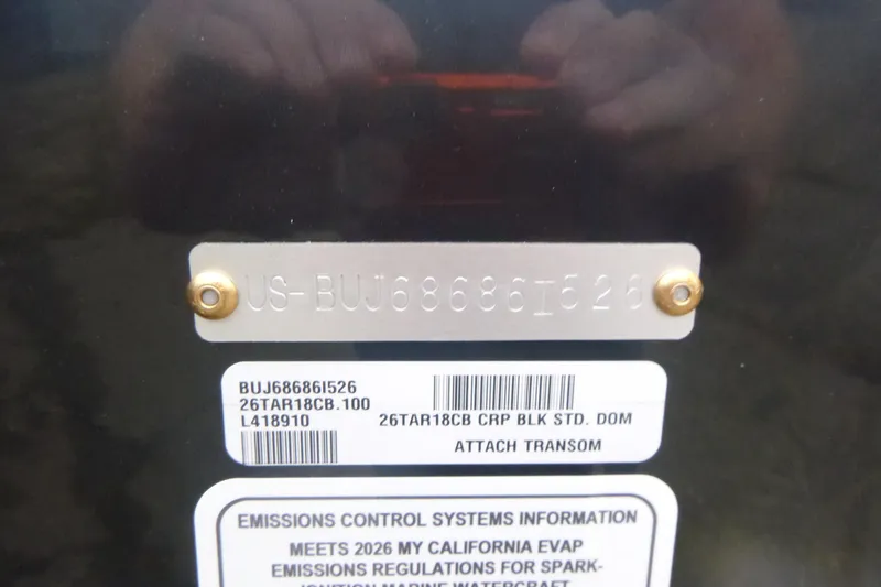 Slide: The Image of 2026 Tracker Targa V-18 Combo boat identification and emissions control labels. - 18