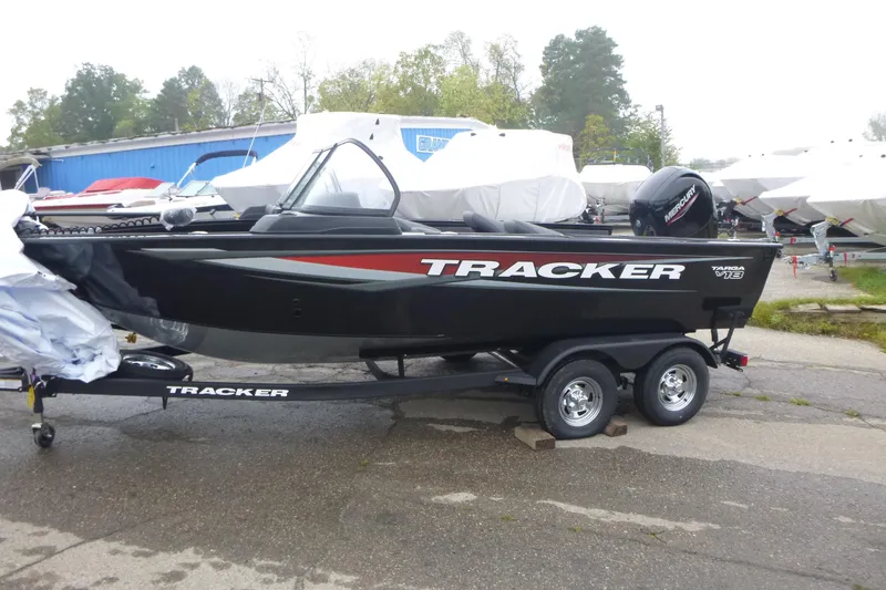 Slide: The Image of 2026 Tracker Targa V-18 Combo boat on trailer, parked outdoors. - 4