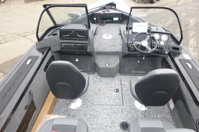 Slide: The Image of 2026 Tracker Targa V-18 Combo boat interior with dual seats and modern dashboard. - 5