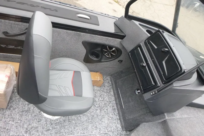 Slide: The Image of 2026 Tracker Targa V-18 Combo boat interior with gray seating and dashboard. - 9