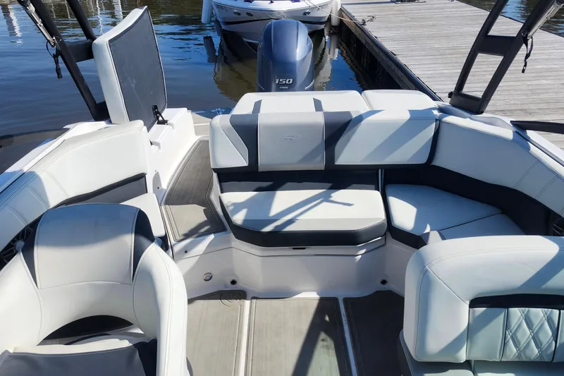 Slide: The Image of 2023 Regal 21 OBX boat interior with plush seating and modern design. - 17