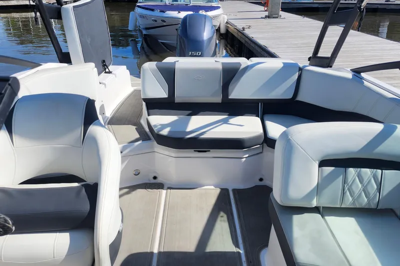 Slide: The Image of 2023 Regal 21 OBX boat interior with plush seating and modern design. - 20