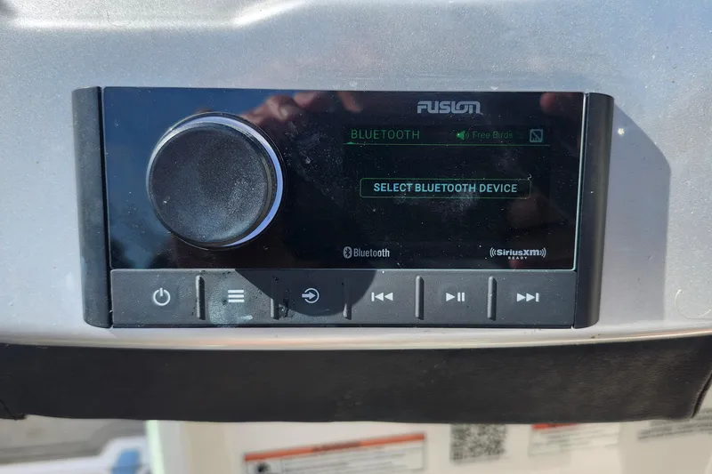 Slide: The Image of Fusion audio system with Bluetooth connectivity in a 2023 Regal 21 OBX boat. - 27