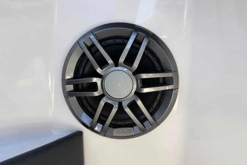 Slide: The Image of Close-up of a Fusion speaker on a 2023 Regal 21 OBX boat. - 28