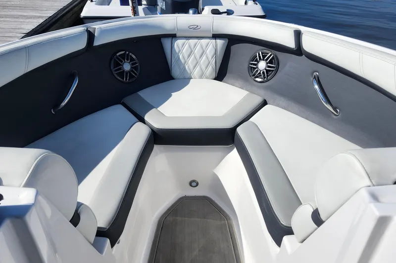 Slide: The Image of Luxurious seating area on 2023 Regal 21 OBX boat with stylish upholstery and speakers. - 6