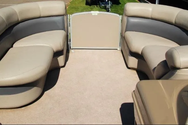 Slide: The Image of Spacious seating area on 2012 Premier 221 Gemini boat with beige upholstery. - 11