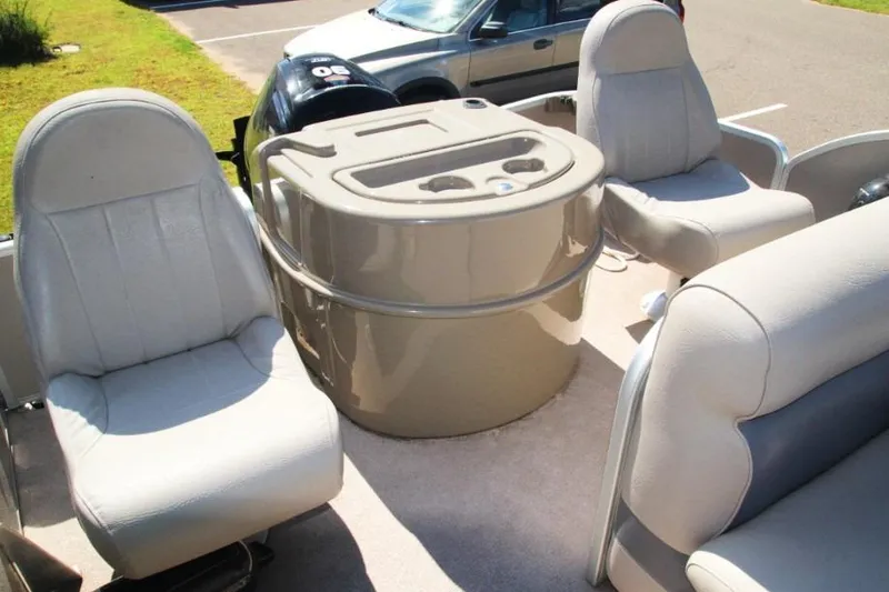 Slide: The Image of Interior of 2012 Premier 221 Gemini boat with seating and console. - 7