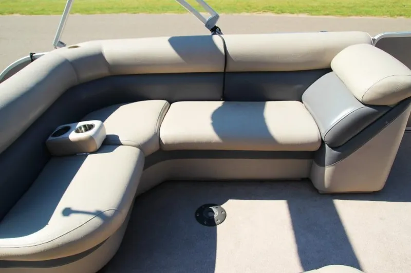 Slide: The Image of Luxurious seating on 2012 Premier 221 Gemini boat with cup holders and plush cushions. - 8