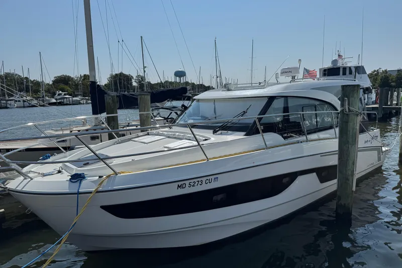 The Image of 2024 Beneteau Antares 11 docked at marina, sleek design, sunny day. - 0