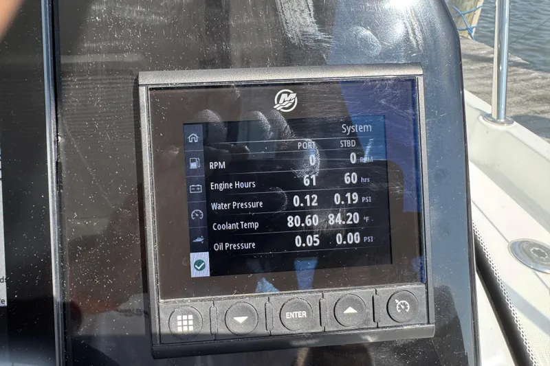Slide: The Image of Display screen on 2024 Beneteau Antares 11 showing engine metrics and system status. - 10