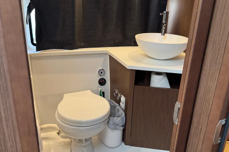 Slide: The Image of 2024 Beneteau Antares 11 bathroom with modern sink and toilet. - 28