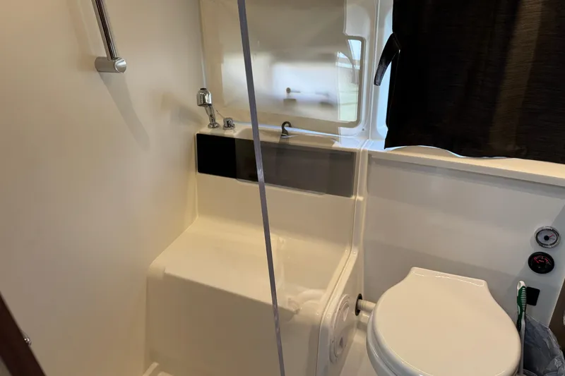 Slide: The Image of Bathroom interior of 2024 Beneteau Antares 11 boat, featuring toilet and sink. - 29