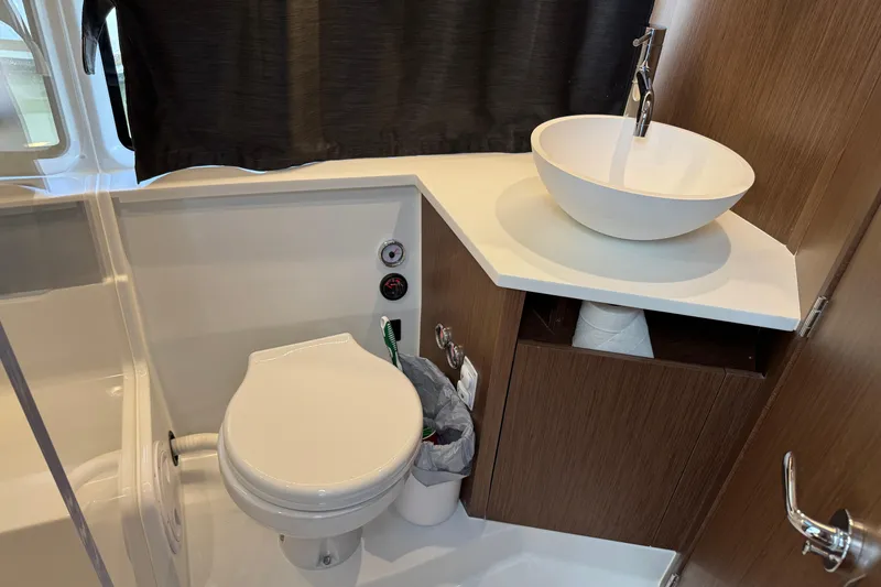 Slide: The Image of 2024 Beneteau Antares 11 bathroom with modern sink and toilet. - 31