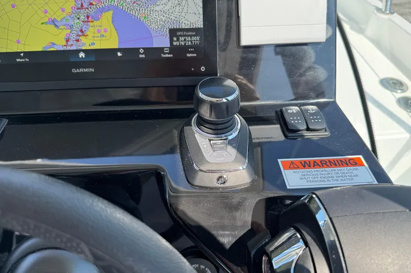 Slide: The Image of Control panel of 2024 Beneteau Antares 11 with Garmin navigation and joystick controls. - 9