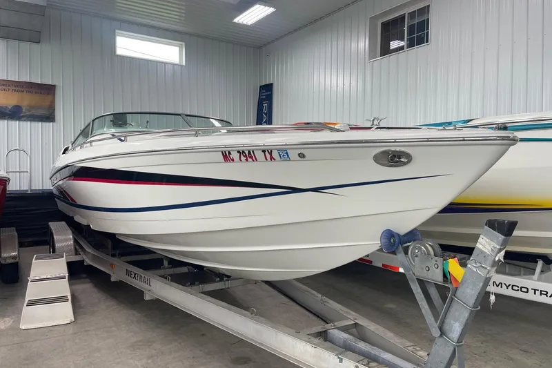Slide: The Image of 2005 Formula 292 FASTech boat on trailer in indoor storage facility. - 0