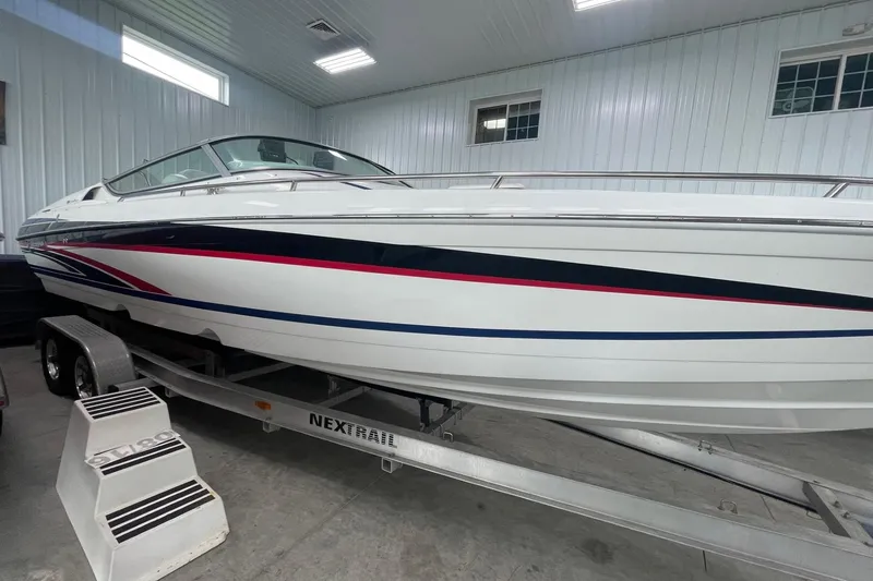 Slide: The Image of 2005 Formula 292 FASTech boat on trailer in indoor storage facility. - 1