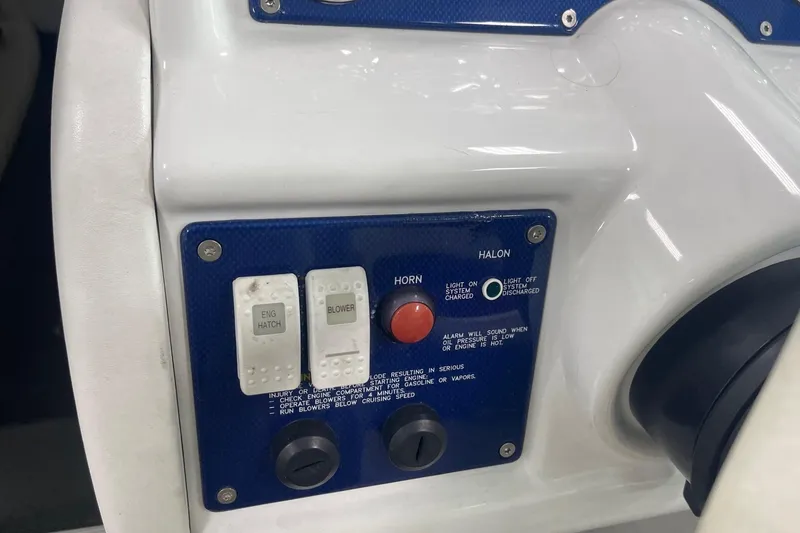 Slide: The Image of Control panel of a 2005 Formula 292 FASTech boat with switches and indicators. - 12