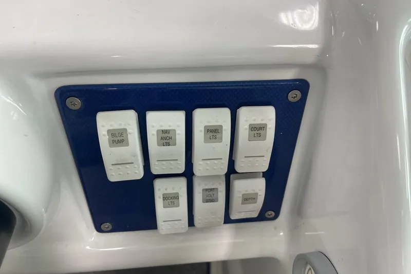 Slide: The Image of Control panel of a 2005 Formula 292 FASTech boat with labeled switches. - 13