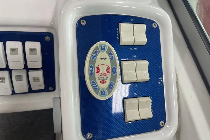 Slide: The Image of Control panel of a 2005 Formula 292 FASTech boat with various switches and buttons. - 14